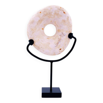 "Wamayuwa" Boiken coin in hand-carved shell mounted on a black metal stand