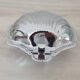 Shell-shaped butter dish in stainless steel and white glass bowl.
