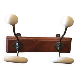 Ceramic and walnut coat rack. The 50's.