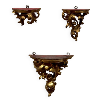 Set of three gilded wood consoles in Rococo style, late 19th century.
