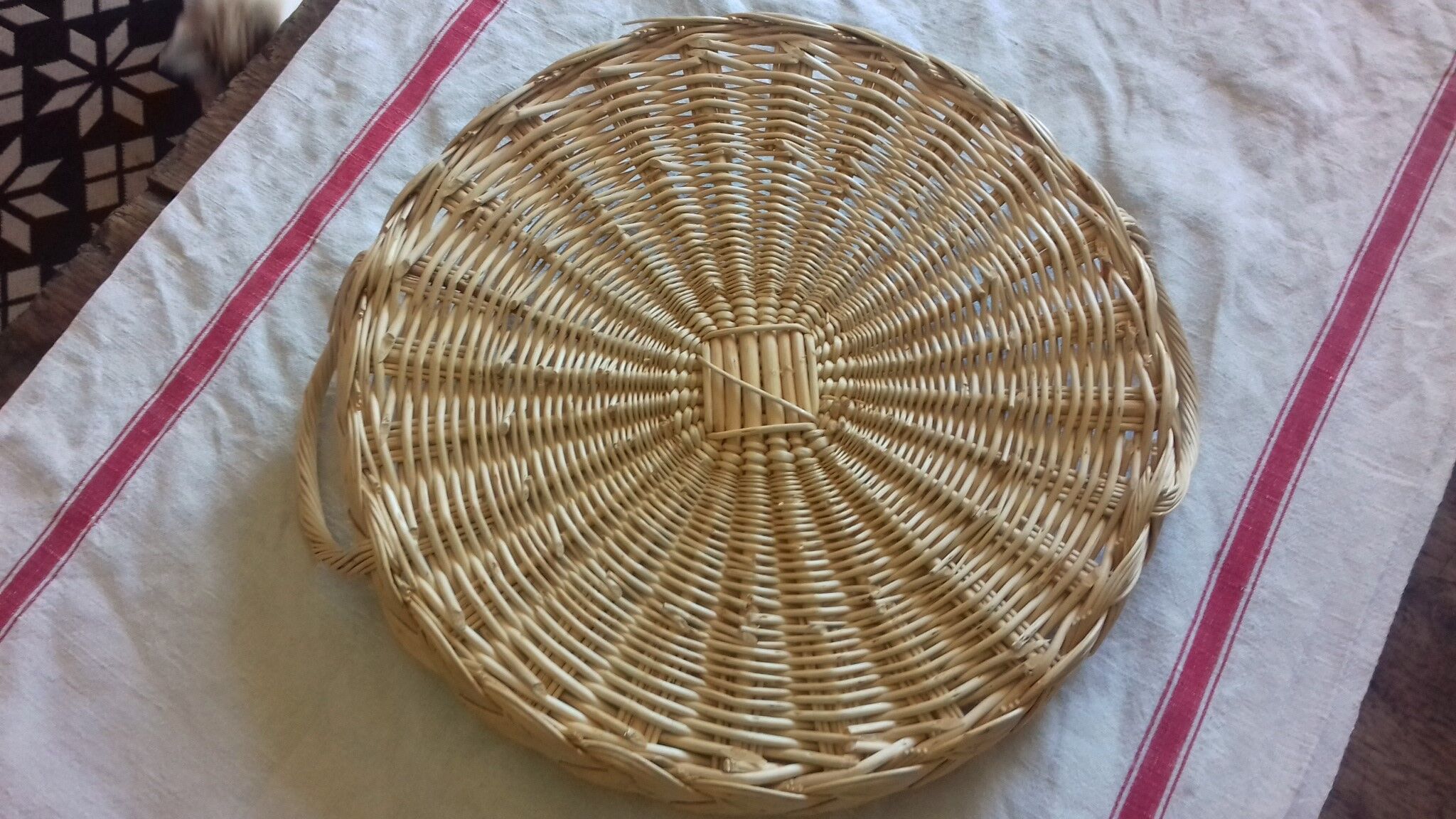 Two-handled vintage round wicker platter