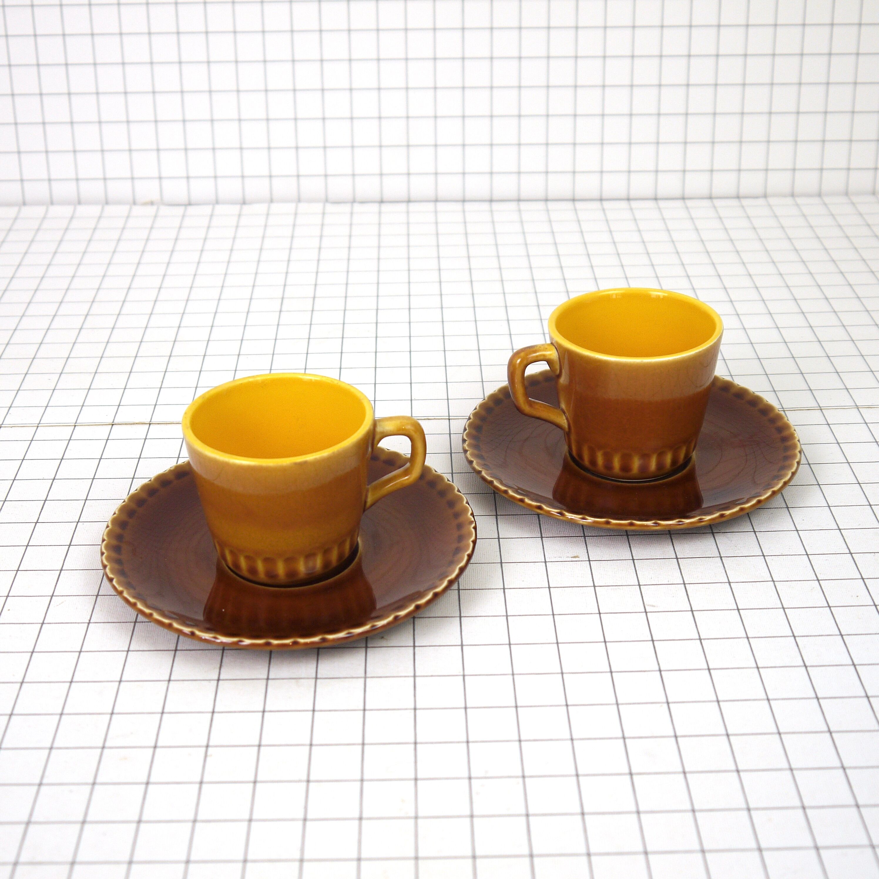Two Digoin cups and saucers