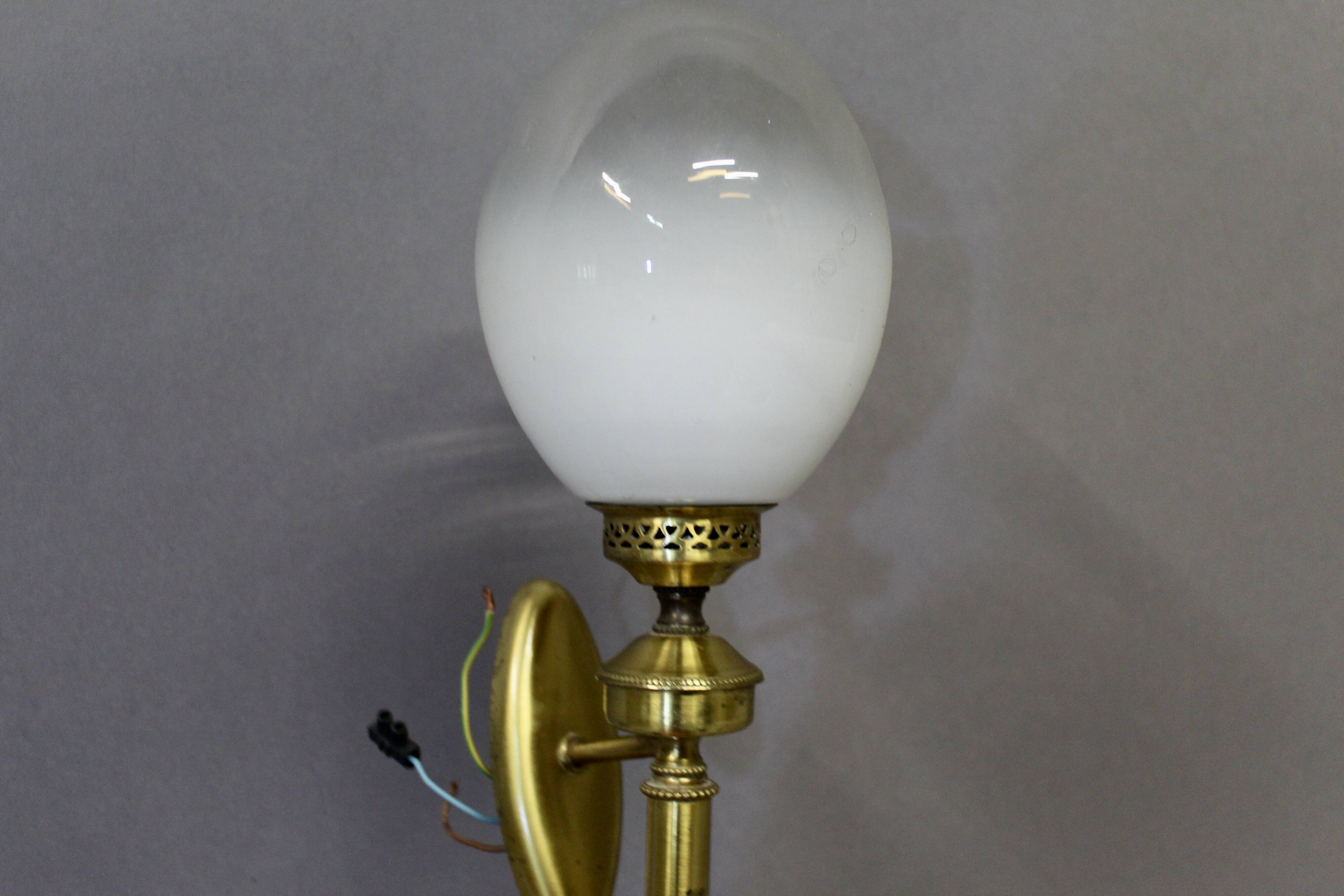 Pair of brass torchiere-style wall lights