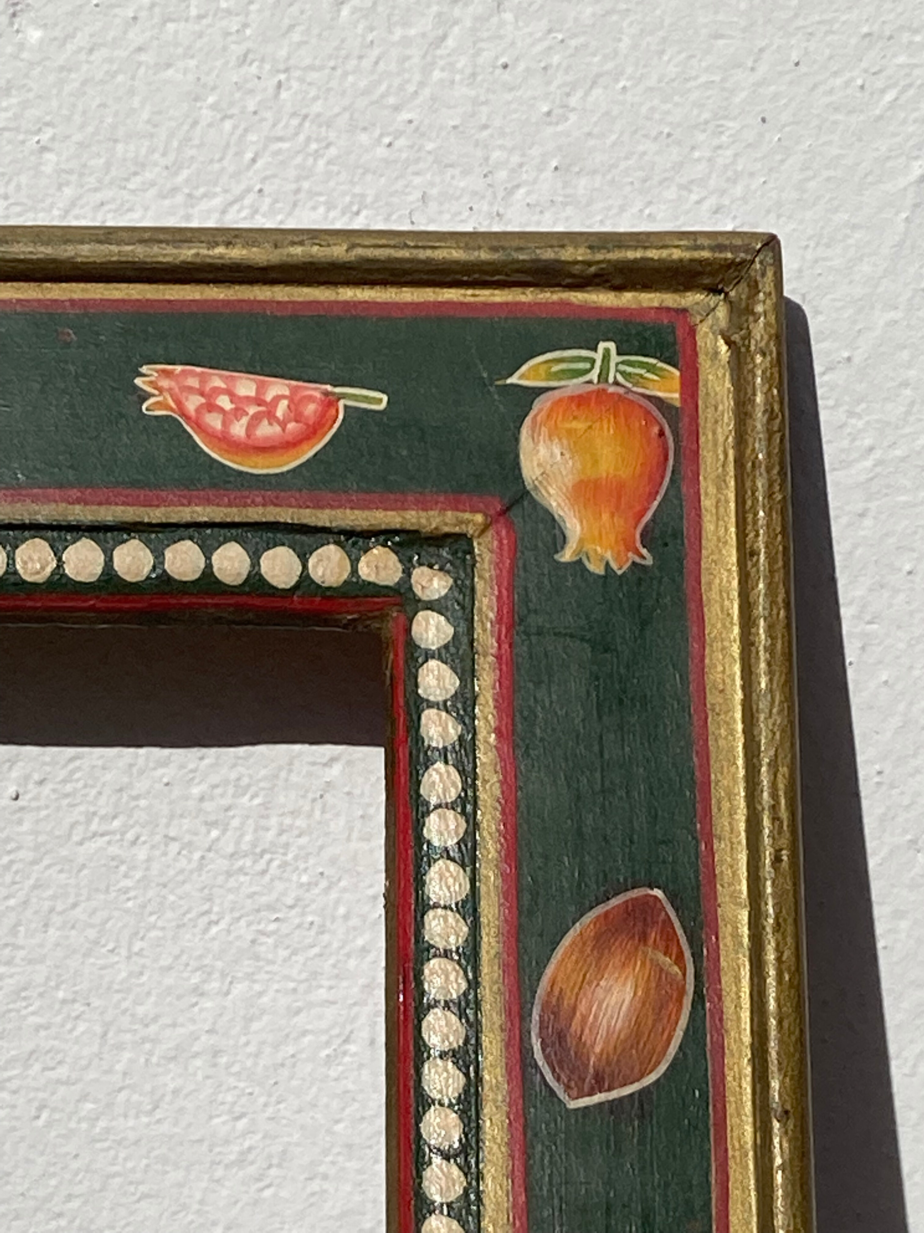 Hand-painted wooden frame with fruit decoration