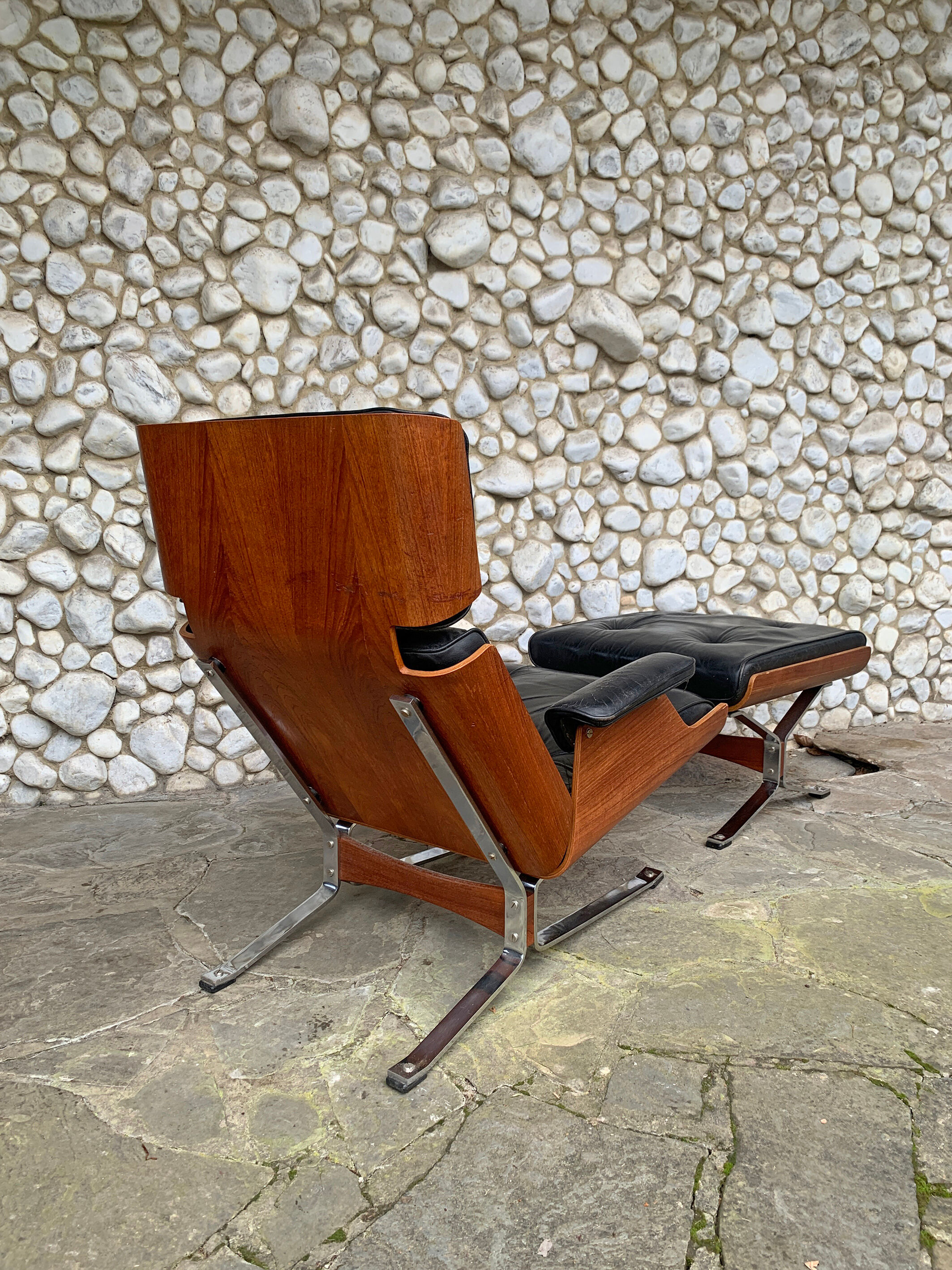 Lounge chair and ottoman black leather and teak multiplex, 1960