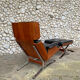 Lounge chair and ottoman black leather and teak multiplex, 1960