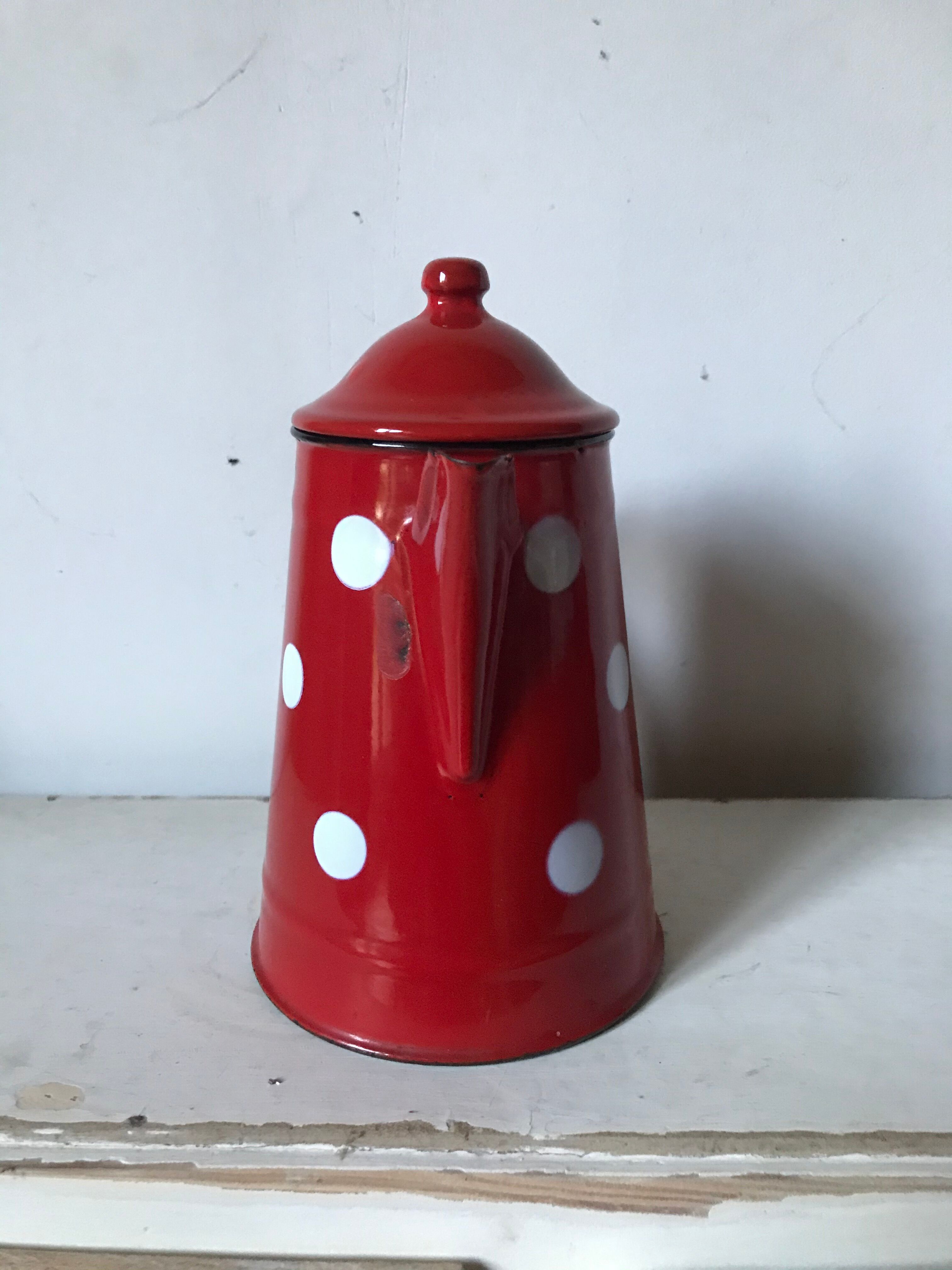 Red enamelled coffee maker with white polka dots
