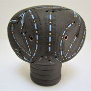 Anthropomorphic candle holder, scarified ceramic, stamped design