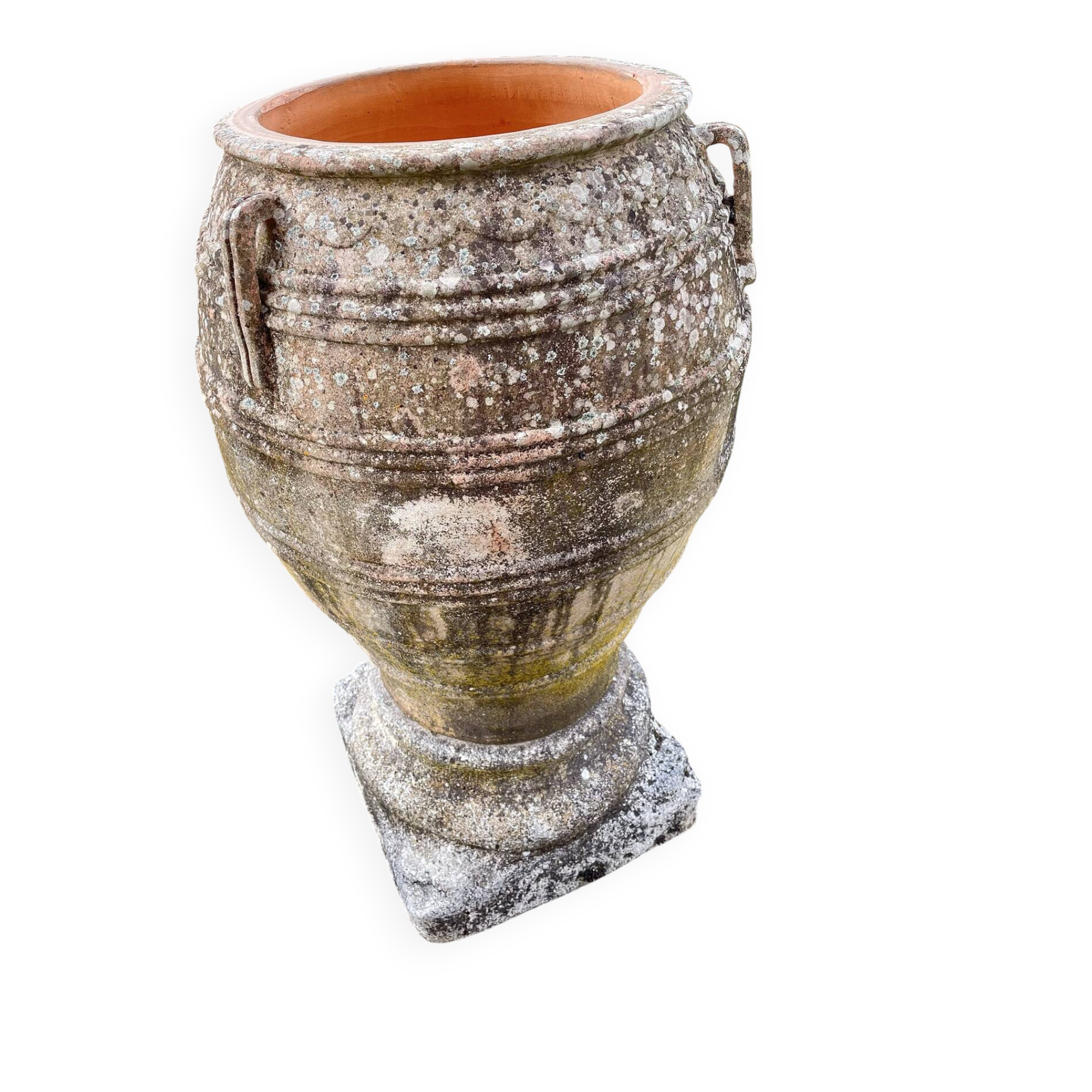 Large Cretan jar in terracotta with three handles on a stone base.