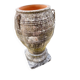 Large Cretan jar in terracotta with three handles on a stone base.