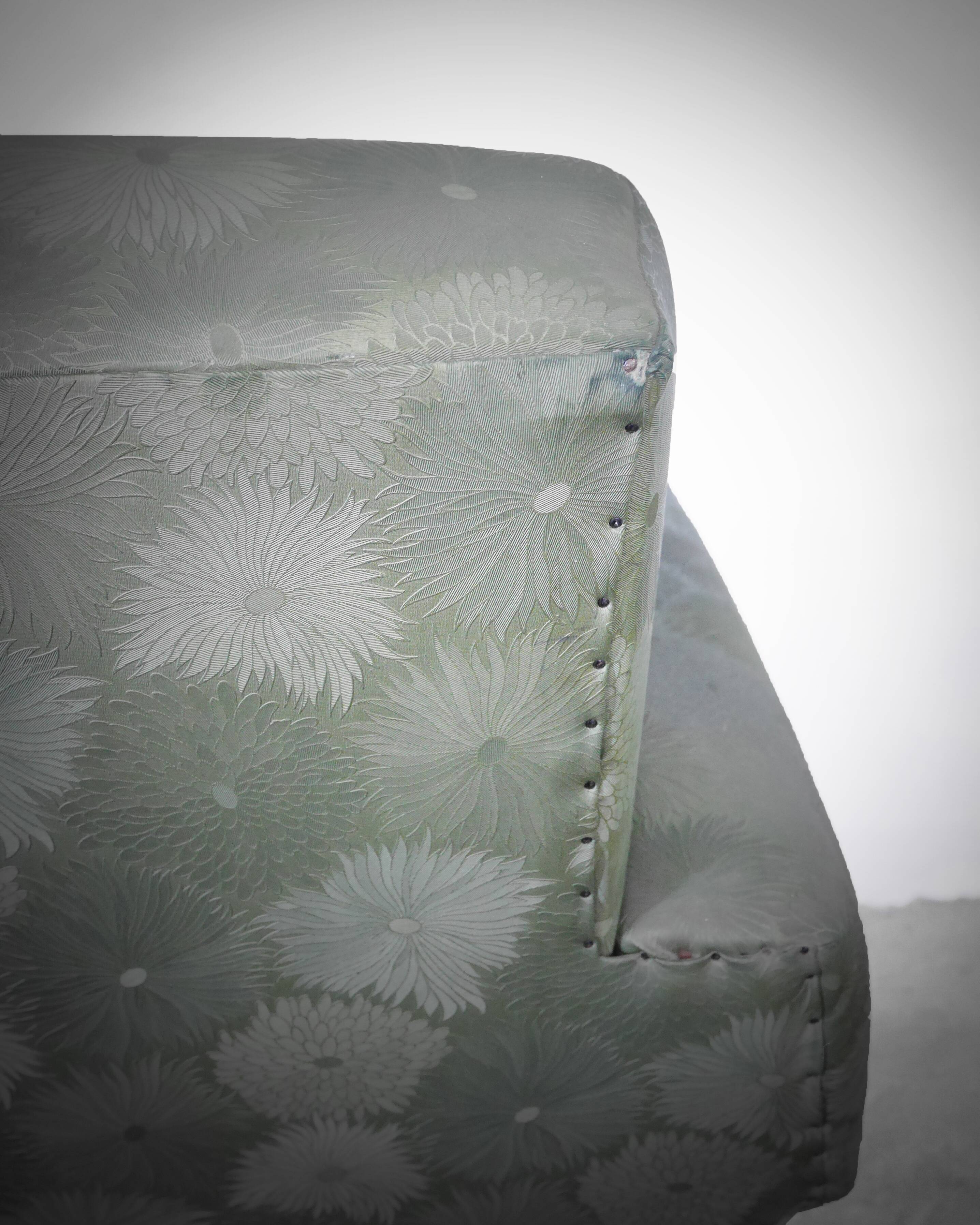 Green armchair in leatherette