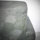 Green armchair in leatherette