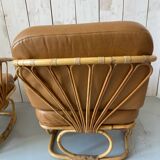 Pair of leather and bamboo armchairs