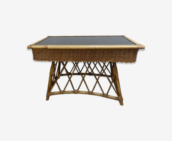 Wicker and black glass side table