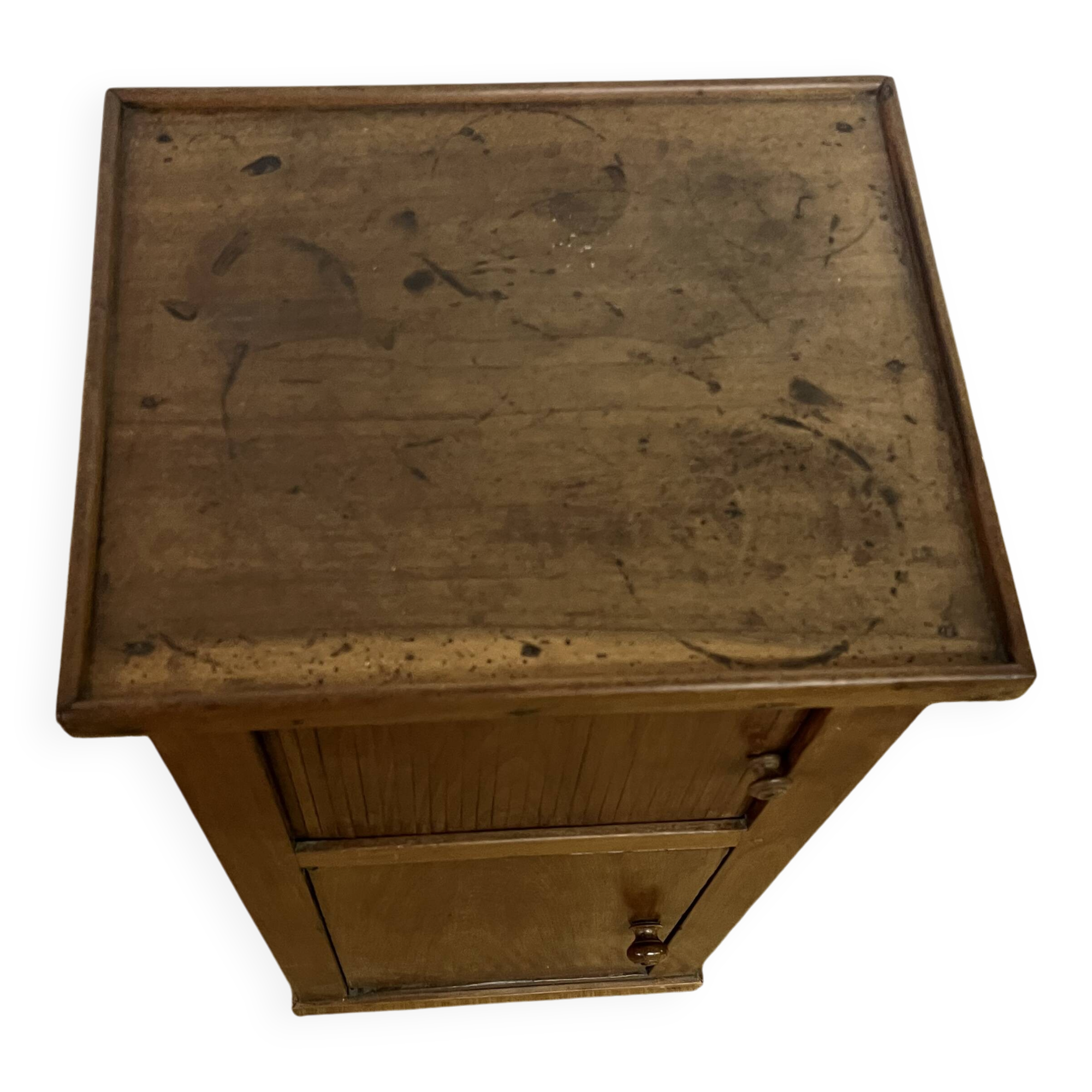 Old small storage unit with sliding and hinged doors.