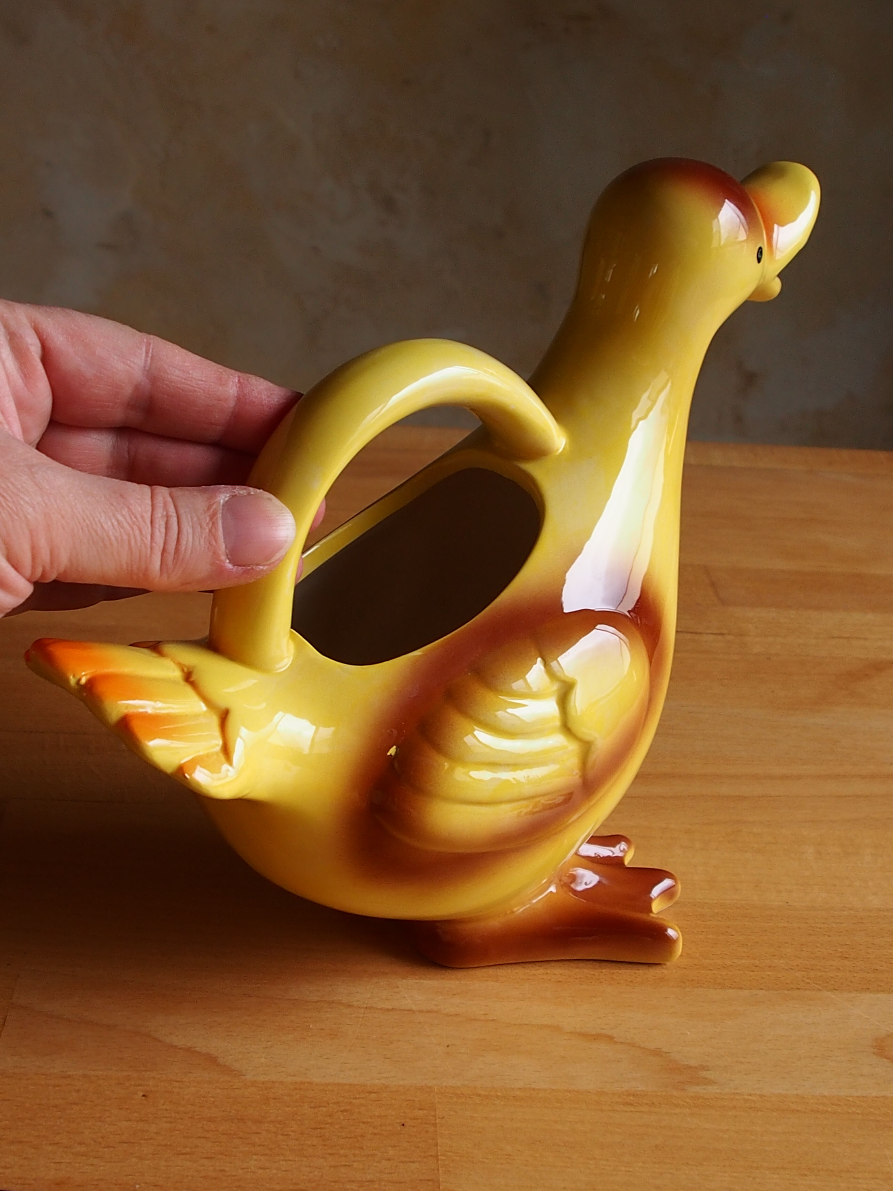 Ceramic watering can in white earthenware, yellow enamel and bird shape