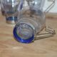 Set of 5 vintage blue-tinted glass cups with metal holders.