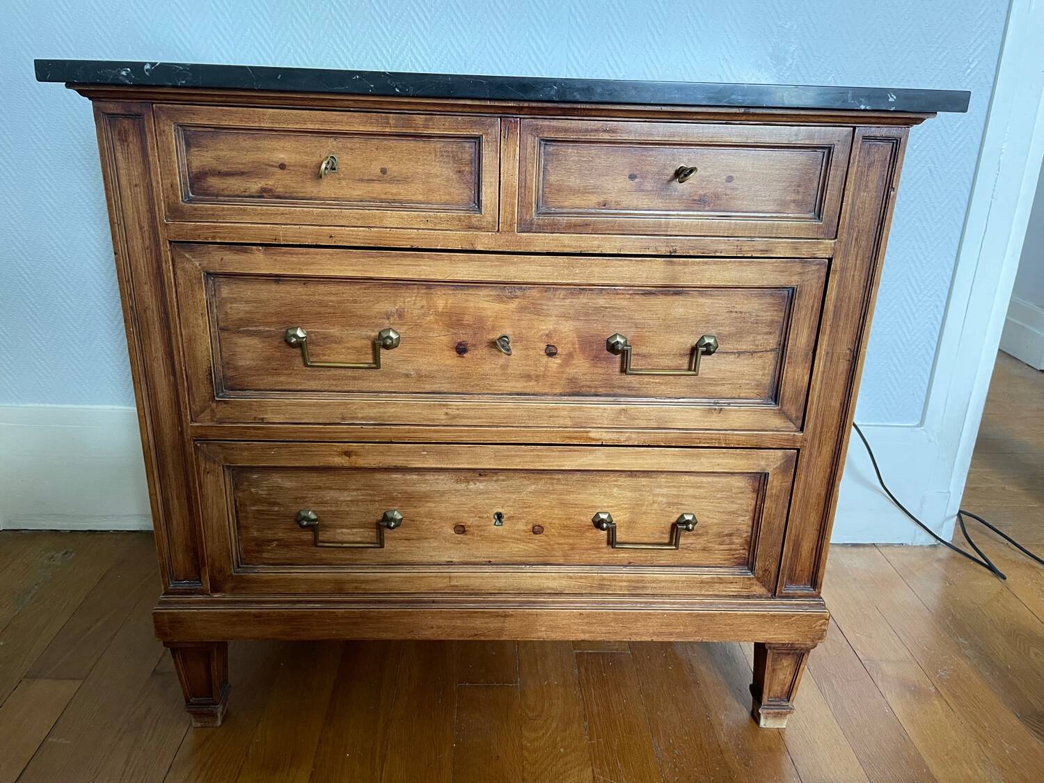 Antique wooden order with black marble top