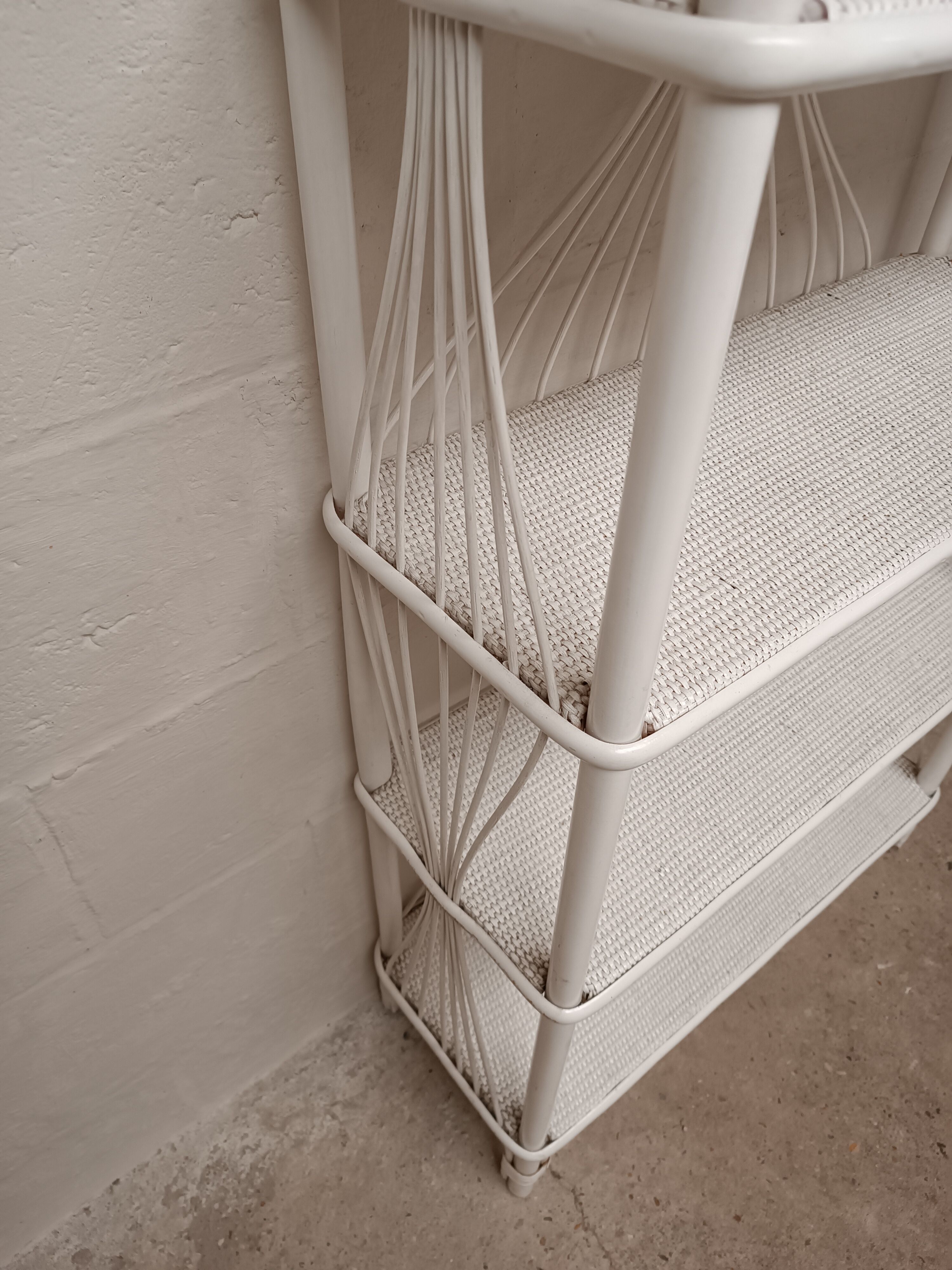 White lacquered rattan bookcase