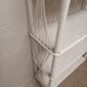 White lacquered rattan bookcase