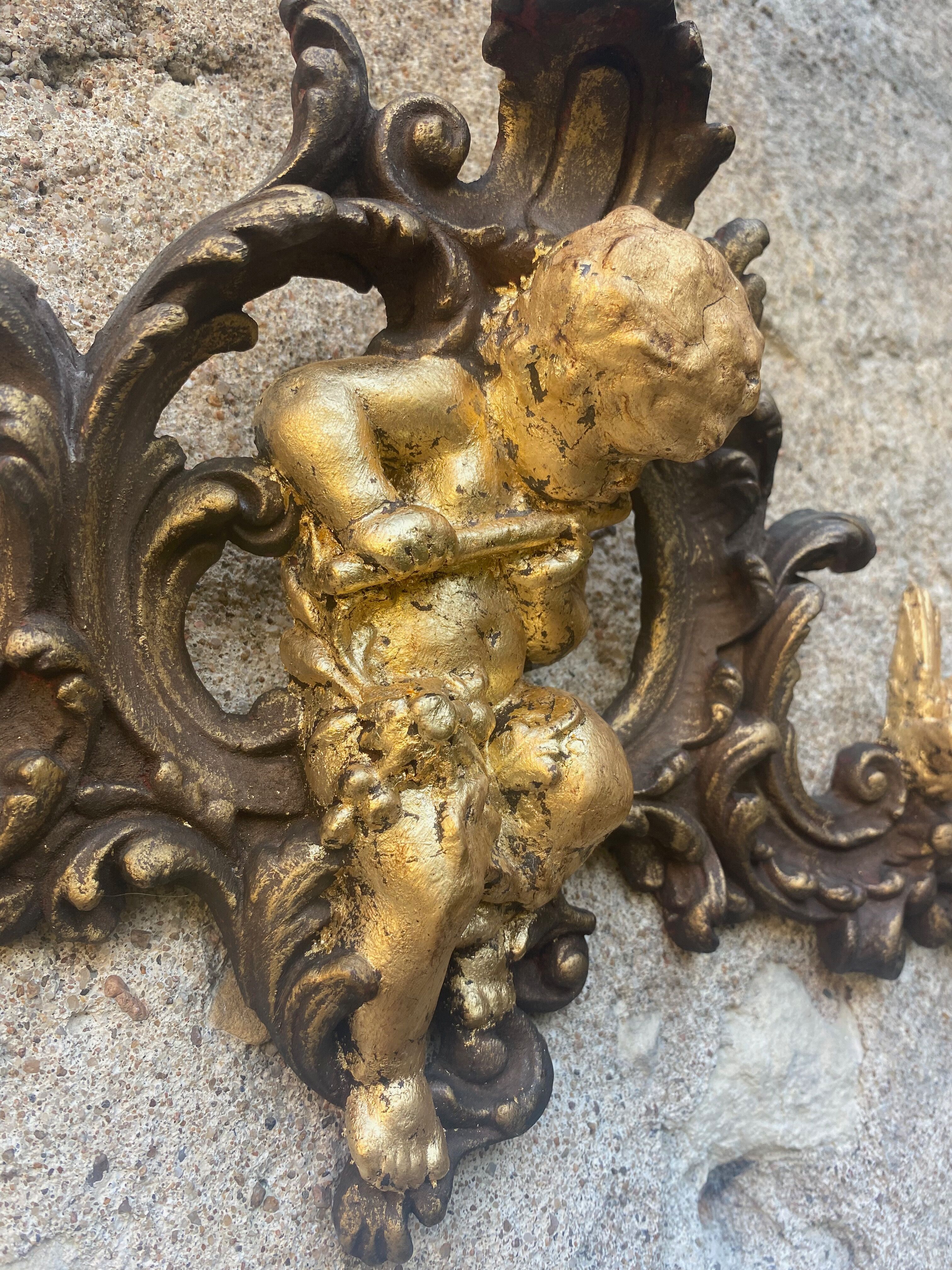 Pediment cherub musician