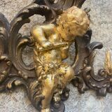 Pediment cherub musician