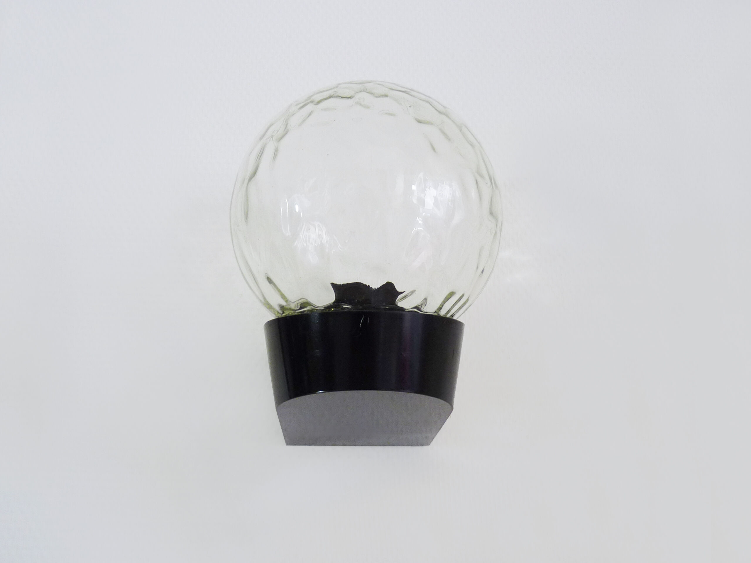 Vintage wall light plastic or bakelite structure, transparent glass globe. Year 70