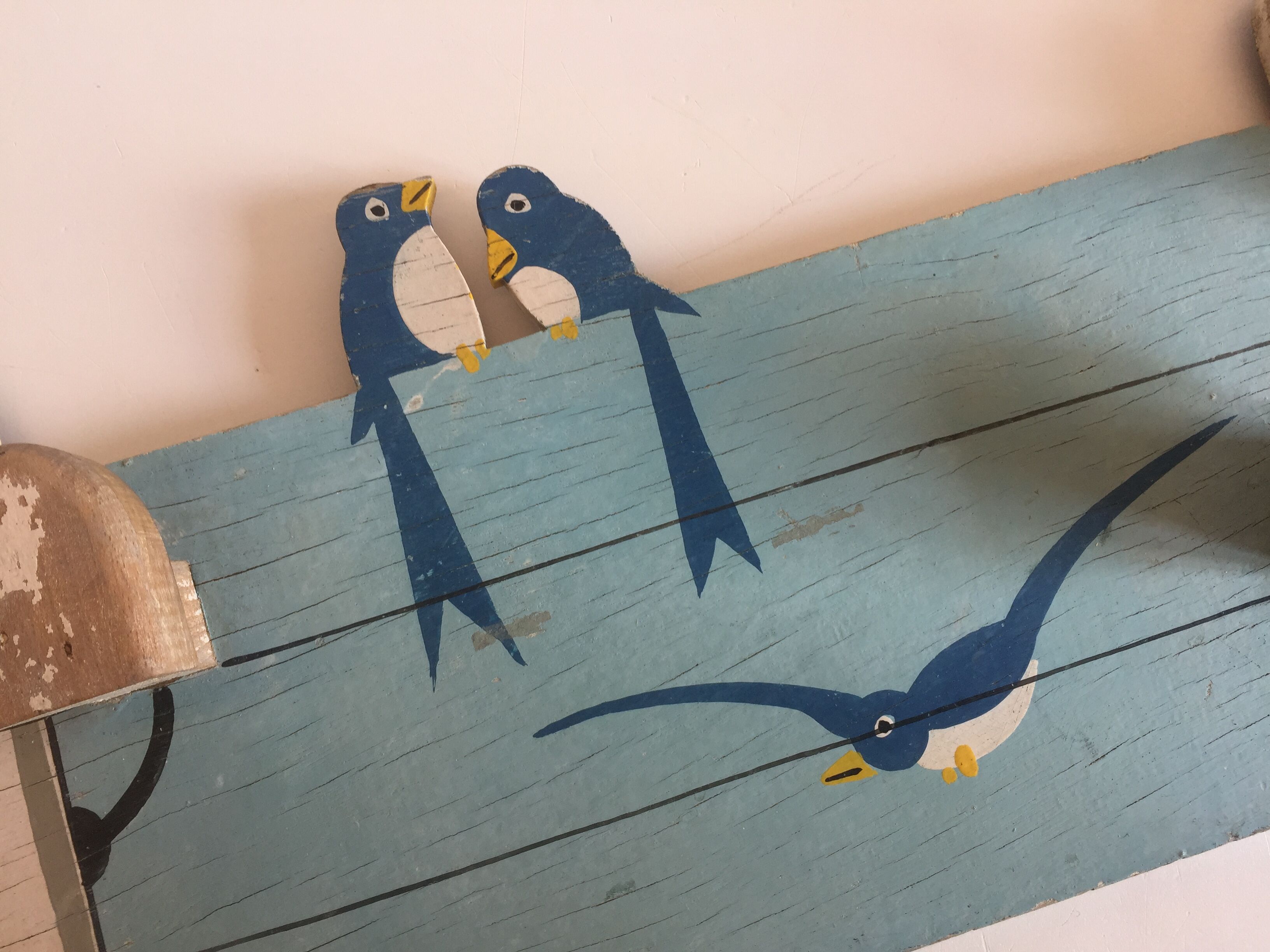Coat rack with vintage swallows