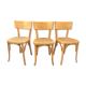 Trio de chaises cannées de style Bauman en hêtre non estampillées.