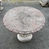 Pretty round table in reconstituted stone