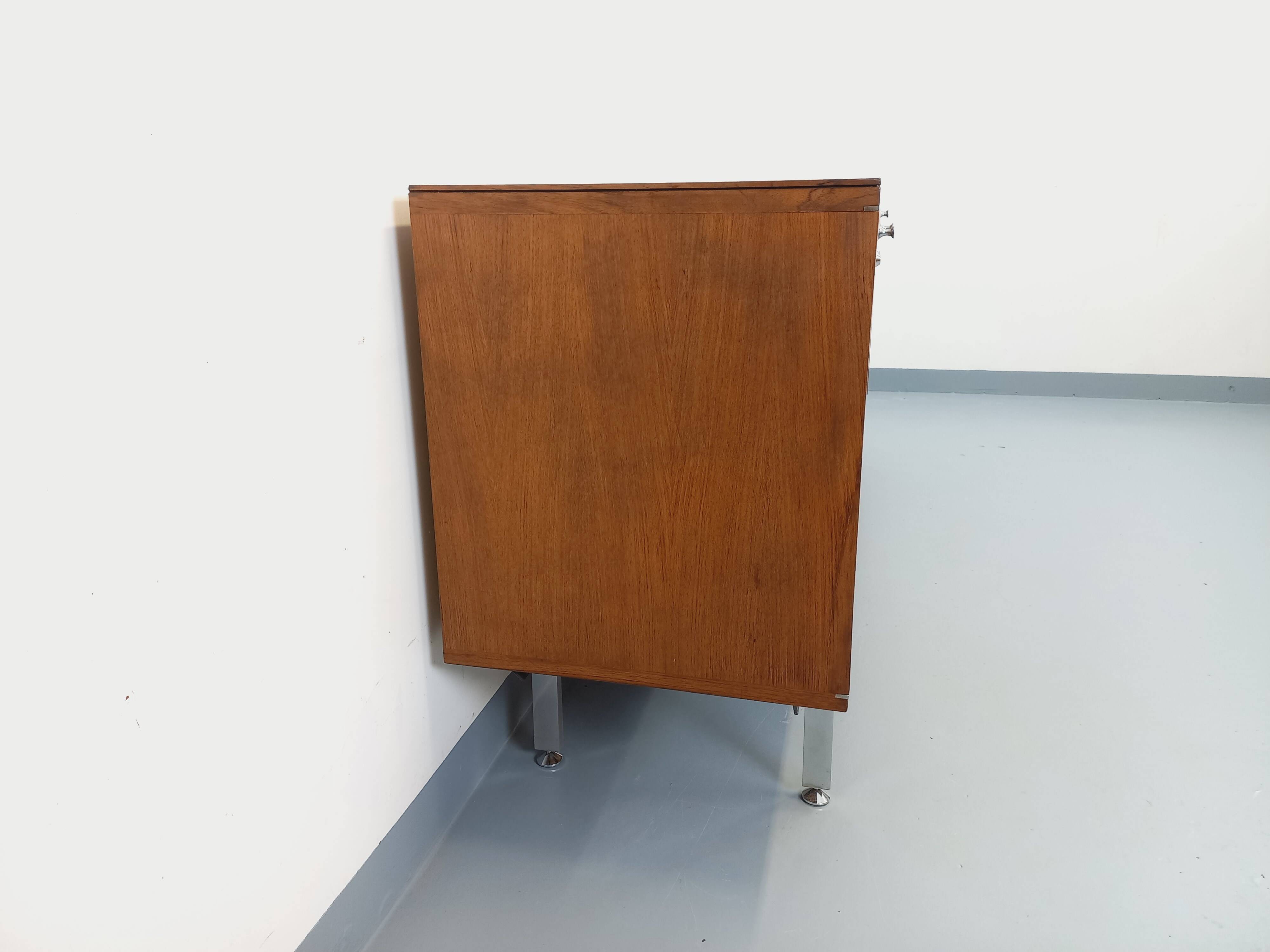 Vintage modernist enfilade in rosewood and chrome metal from the 60s and 70s.