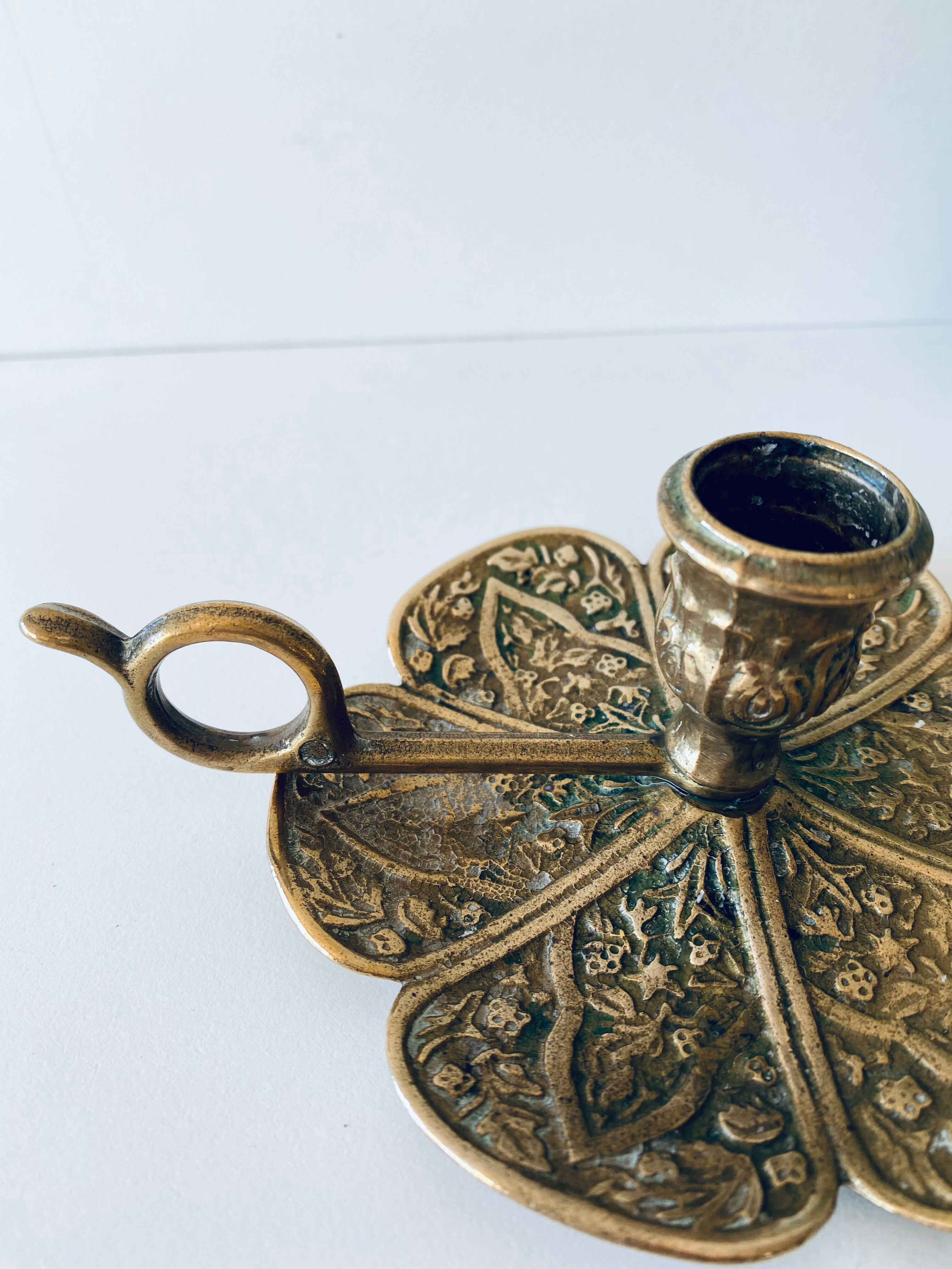 Pair of brass clover candlesticks