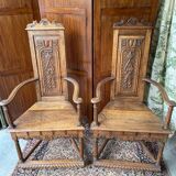 Pair of Renaissance style carved walnut armchairs