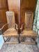 Pair of carved walnut armchairs in Renaissance style