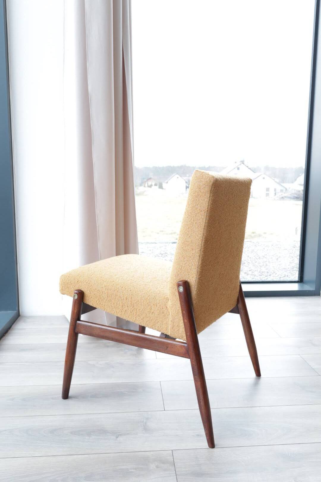 Yellow vintage lounge chair armrests boucle upholstery, walnut wood, Scandi