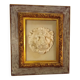 Antique gilded frame with stone lion head ornament on plexiglass