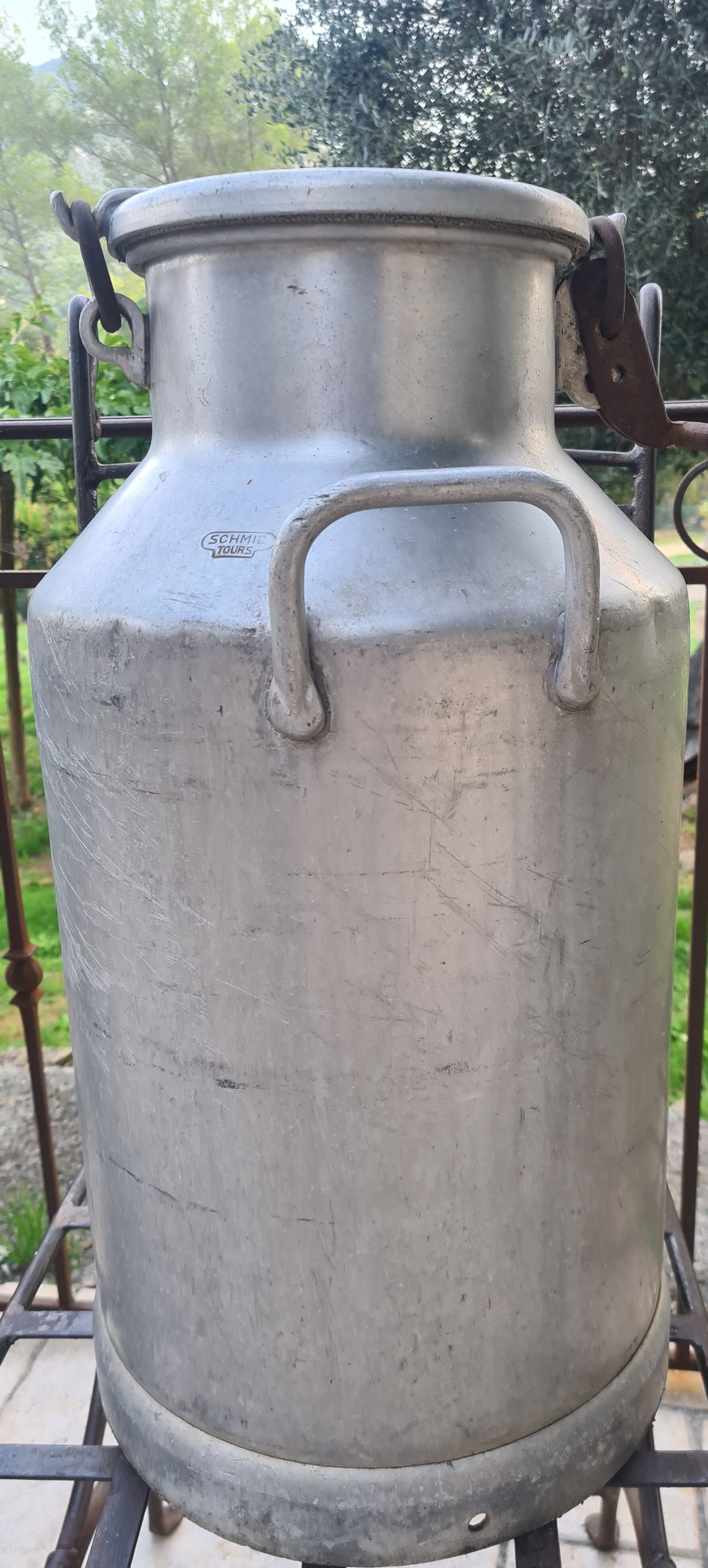set of 2 old aluminum milk jugs