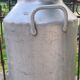 set of 2 old aluminum milk jugs