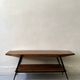 Mid-century coffee table with 2 mahogany wood tops and brass detail, Italy.