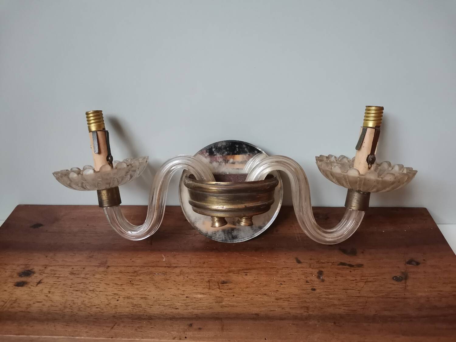 Old vintage wall lamp, brass glass and fake candle mirror