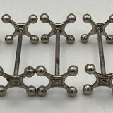 Set of 7 vintage knife rests in the shape of crosses in silver-plated metal.