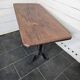 Bistro table with cast iron legs and solid wood top