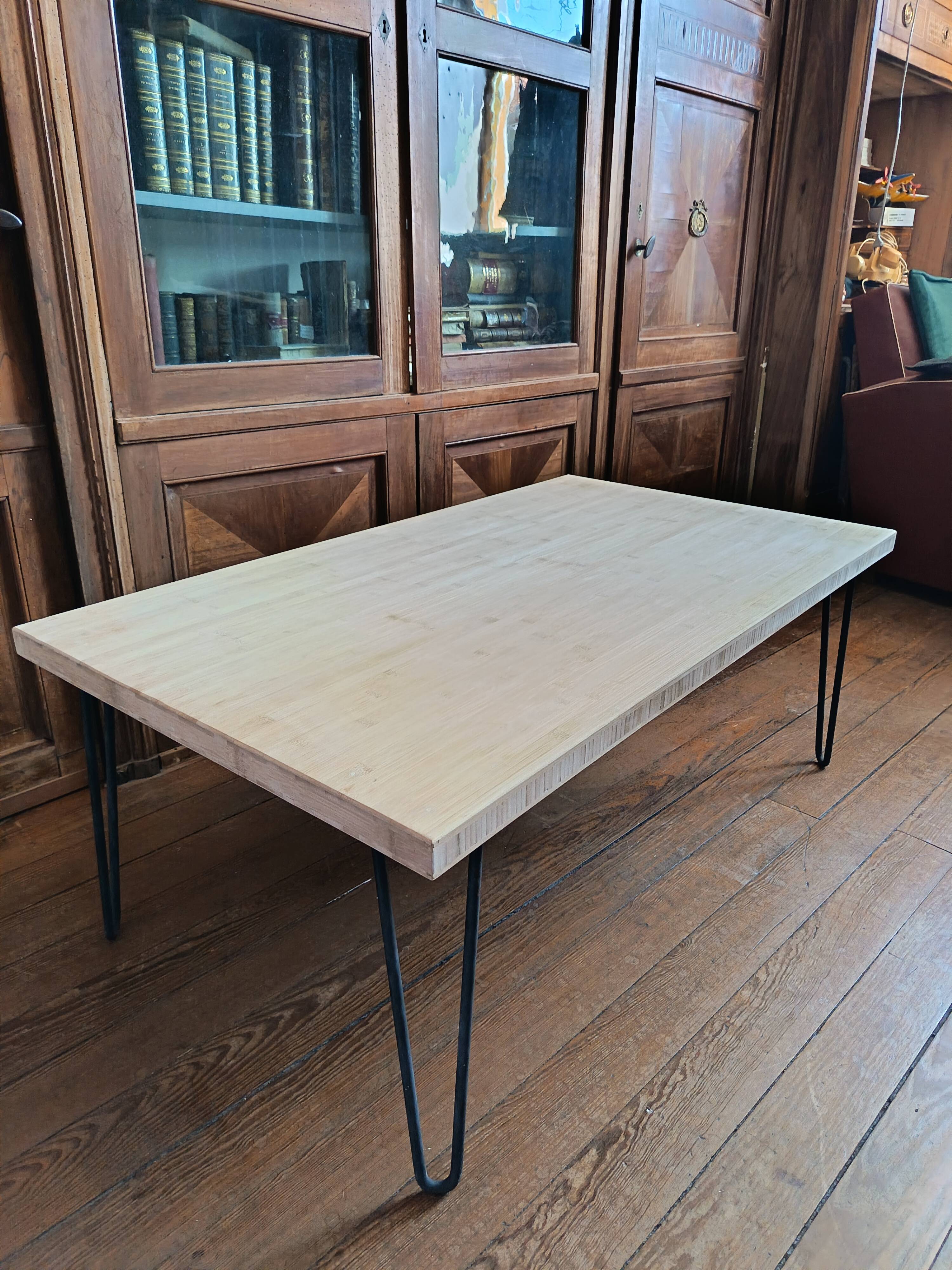 Coffee table in solid bamboo with steel legs.
