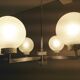 Six-light chrome metal chandelier and opaque glass globes / vintage 60s and 70s