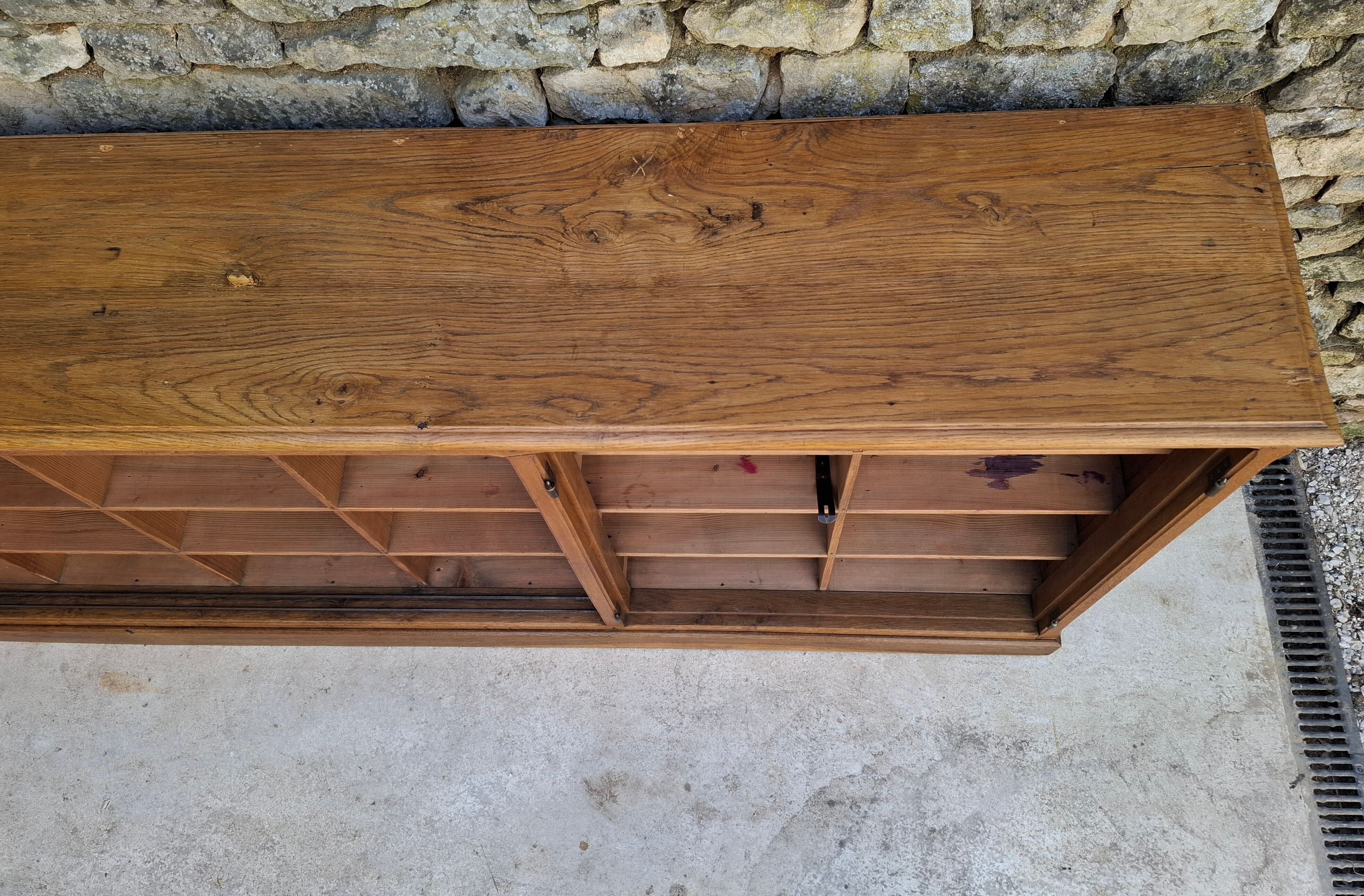 Oak workshop furniture with sliding doors.