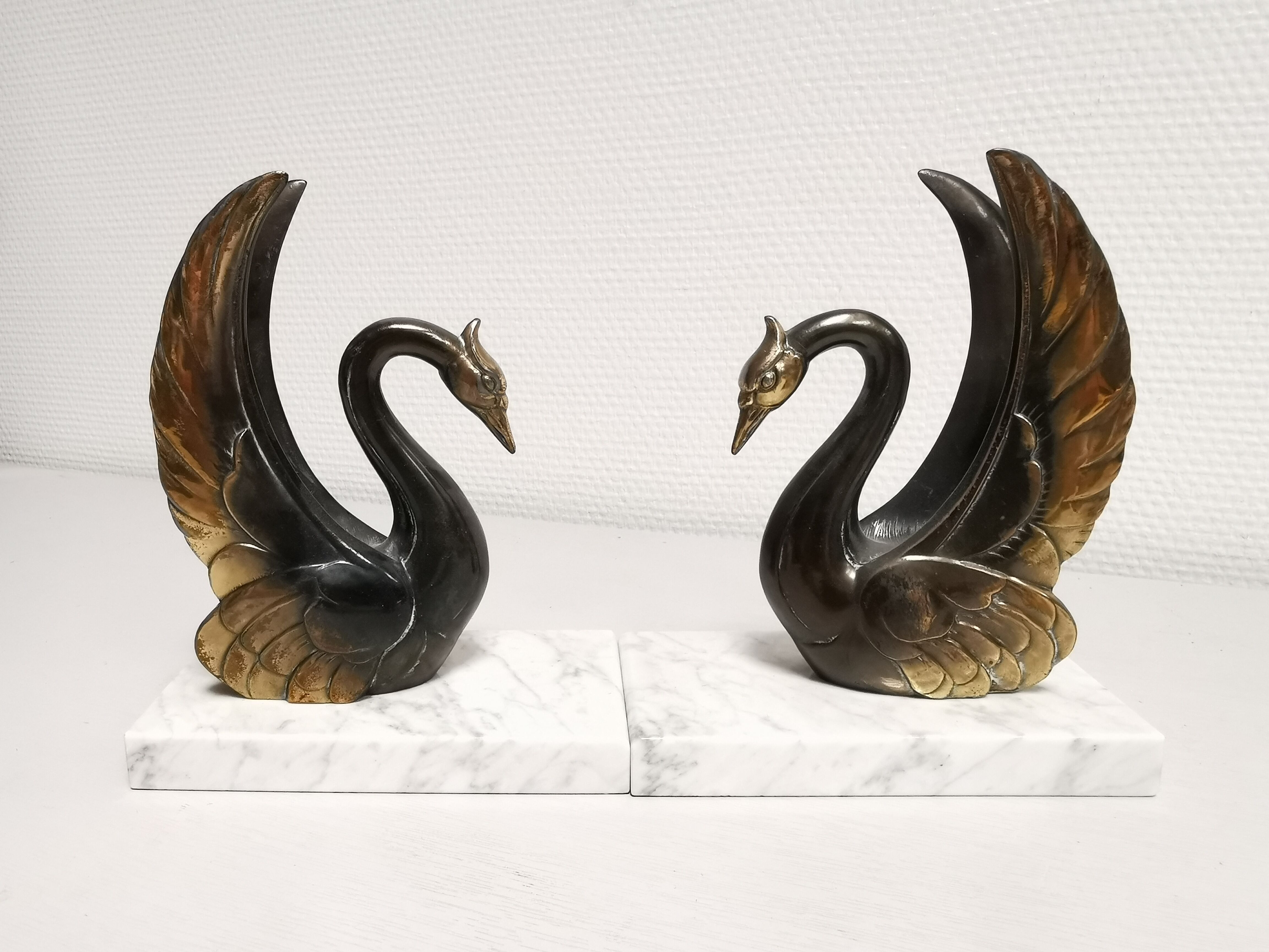 Pair of ancient zoomorphic bookends, swan statues