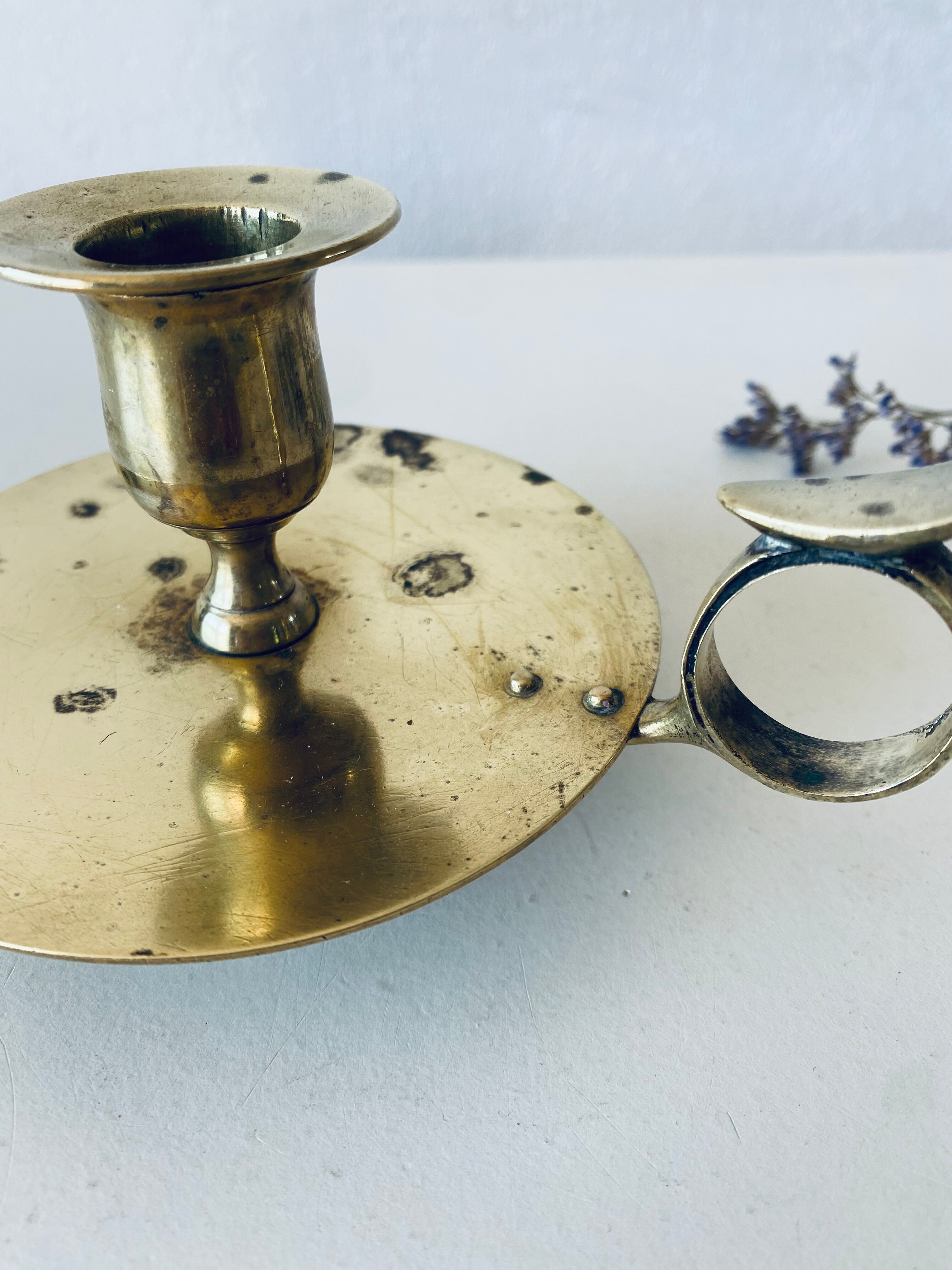 Old candle holder with handle