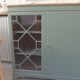 English sideboard, shallow, smoky green, wooden top.