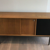 Row with double sliding doors and bar on metal base
