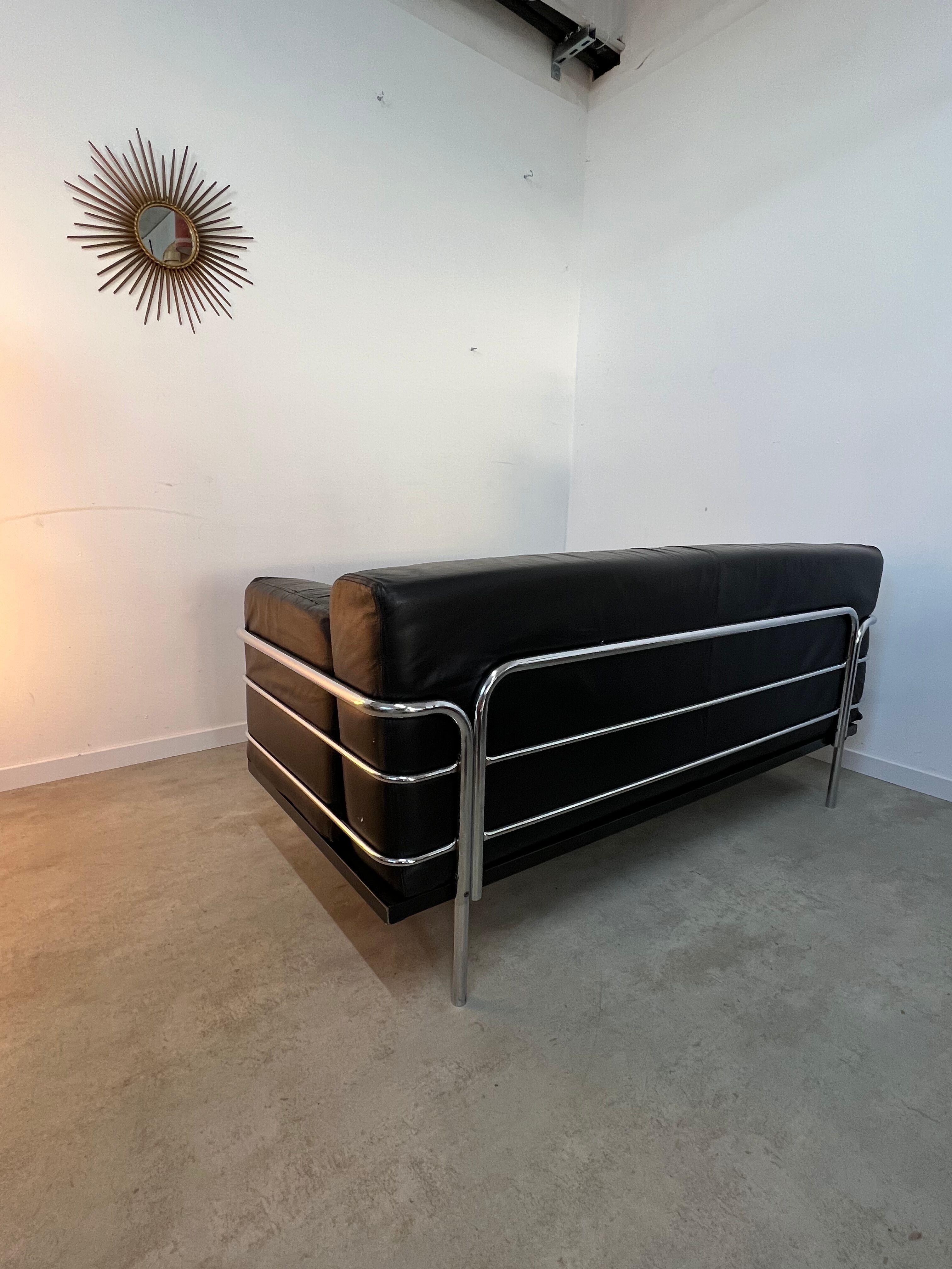 Old vintage leather and tubular metal sofa, design 70s